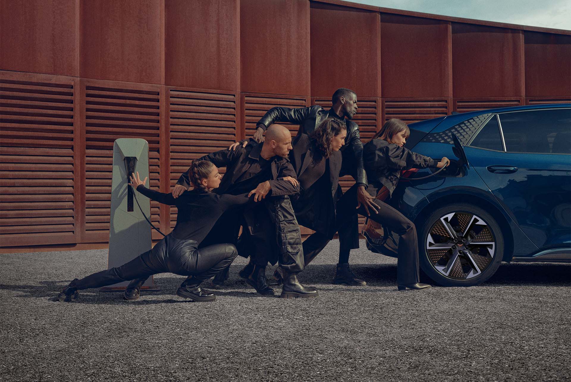 People posing with CUPRA Born charging